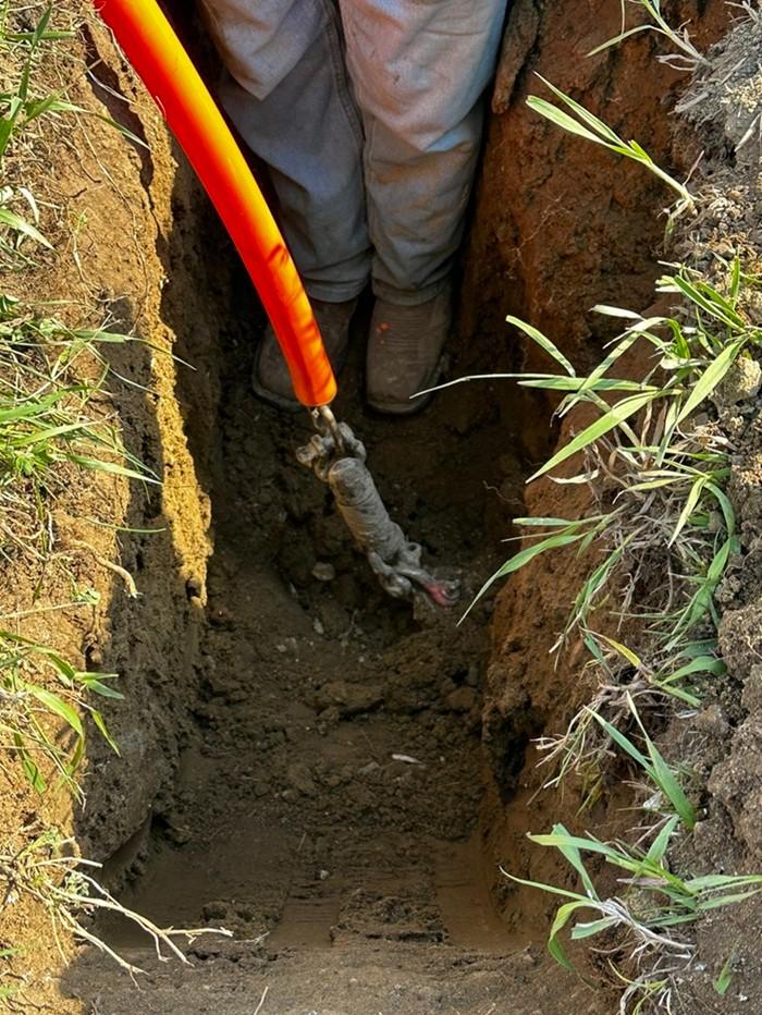 Hidewood Fiber crew member working on an underground fiber installation in rural South Dakota